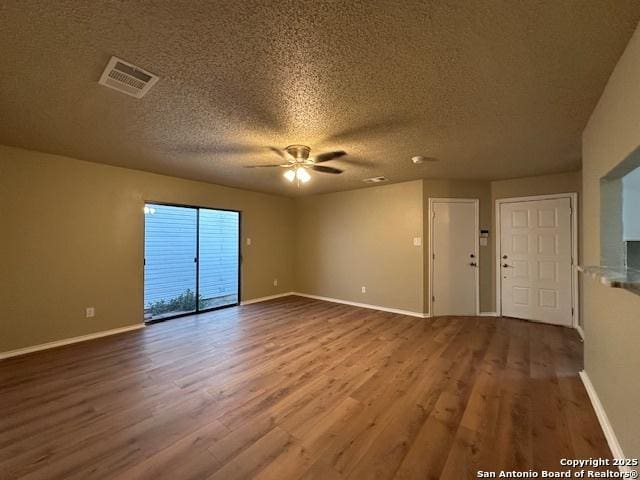 16454 Blanco Ky, San Antonio, TX 78247 - spare room featuring ceiling fan, wood finished floors, and a textured ceiling