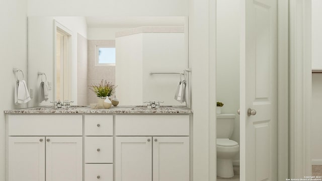 5751 Musquiz Rdg, Seguin, TX 78155 - full bathroom featuring double vanity and toilet