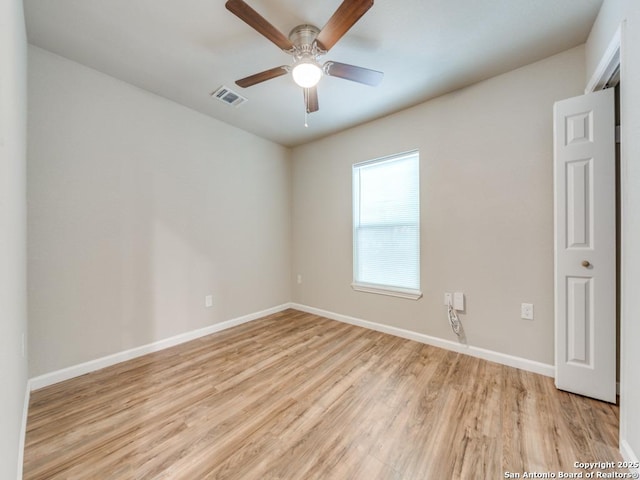 122 Adrian, San Antonio, TX 78213 - empty room with light wood-type flooring and ceiling fan