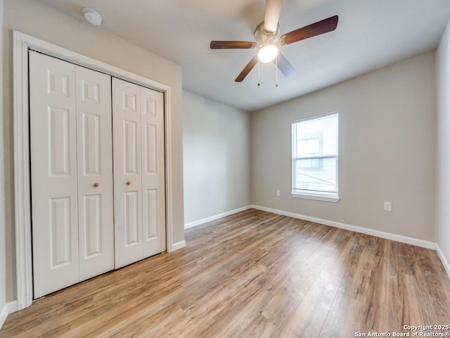 122 Adrian, San Antonio, TX 78213 - unfurnished bedroom with light wood finished floors, a closet, and a ceiling fan