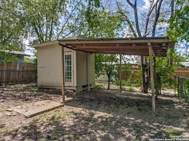 122 Adrian, San Antonio, TX 78213 - view of shed featuring a fenced backyard and a carport