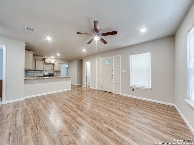 122 Adrian, San Antonio, TX 78213 - unfurnished living room with ceiling fan, recessed lighting, and light wood-style flooring