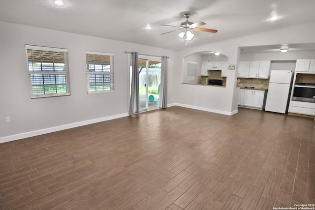 7730 Pipers Vw, San Antonio, TX 78251 - unfurnished living room with ceiling fan, dark wood-style flooring, and plenty of natural light