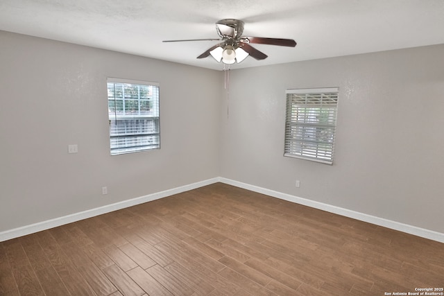 7730 Pipers Vw, San Antonio, TX 78251 - empty room with ceiling fan and dark wood finished floors