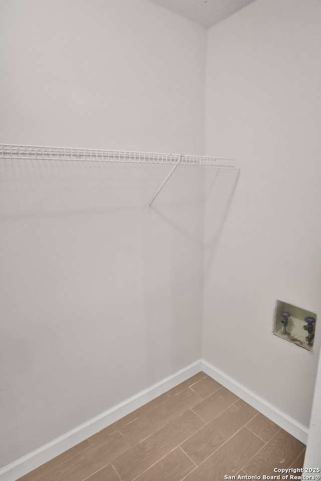 7730 Pipers Vw, San Antonio, TX 78251 - washroom with hookup for a washing machine and wood finished floors