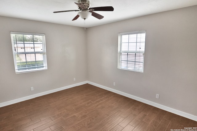 7730 Pipers Vw, San Antonio, TX 78251 - spare room with healthy amount of natural light, dark wood-style floors, and ceiling fan