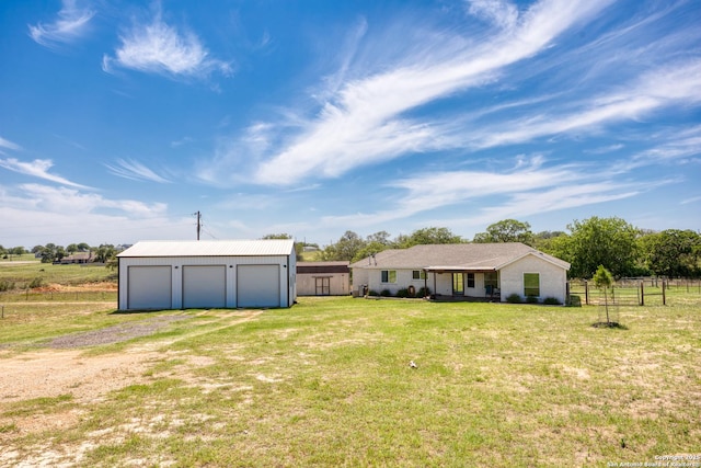177 Lakeview Cir, La Vernia, TX 78121 - view of yard featuring an outdoor structure, driveway, and a garage
