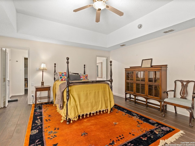 9715 Laurel Oaks, San Antonio, TX 78240 - bedroom featuring hardwood / wood-style floors and a tray ceiling