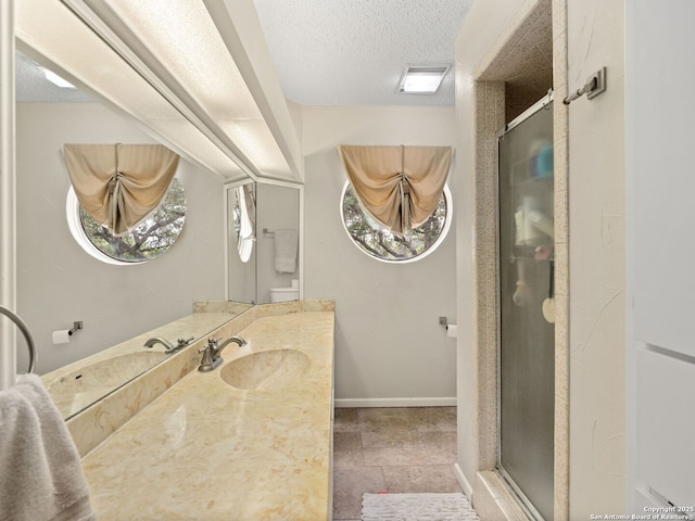 9715 Laurel Oaks, San Antonio, TX 78240 - full bathroom with a stall shower, vanity, and a textured ceiling
