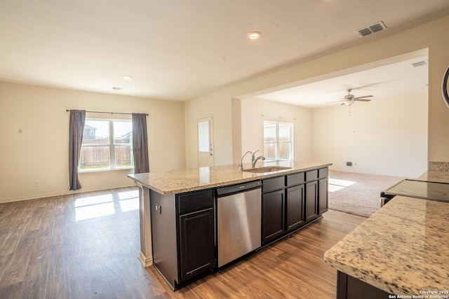 7335 Sharma Vly, San Antonio, TX 78252 - kitchen featuring stainless steel dishwasher, plenty of natural light, open floor plan, light wood finished floors, and recessed lighting