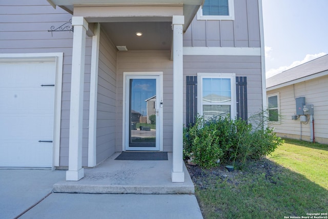7335 Sharma Vly, San Antonio, TX 78252 - view of exterior entry featuring an attached garage and board and batten siding