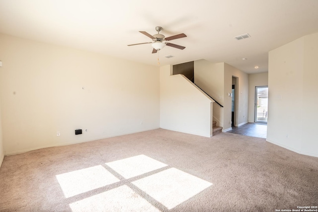 7335 Sharma Vly, San Antonio, TX 78252 - carpeted empty room featuring ceiling fan and stairs