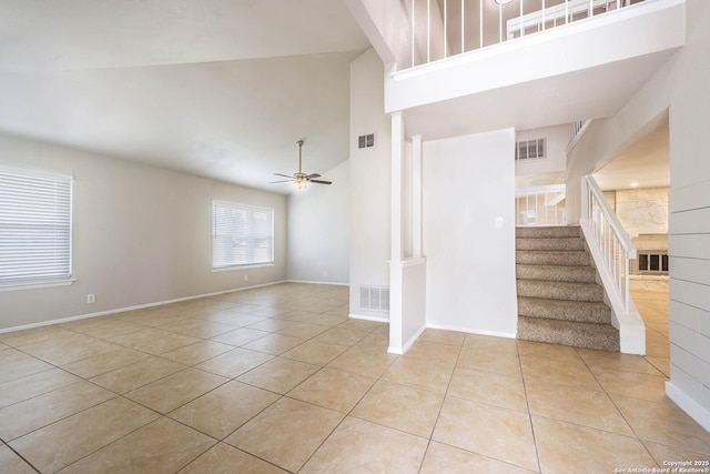 6914 Ludgate, San Antonio, TX 78239 - unfurnished room featuring light tile patterned floors, high vaulted ceiling, stairs, and a ceiling fan