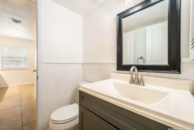 6914 Ludgate, San Antonio, TX 78239 - bathroom featuring vanity, wainscoting, and tile patterned flooring