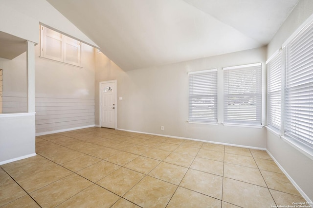 6914 Ludgate, San Antonio, TX 78239 - spare room featuring lofted ceiling, light tile patterned floors, and healthy amount of natural light