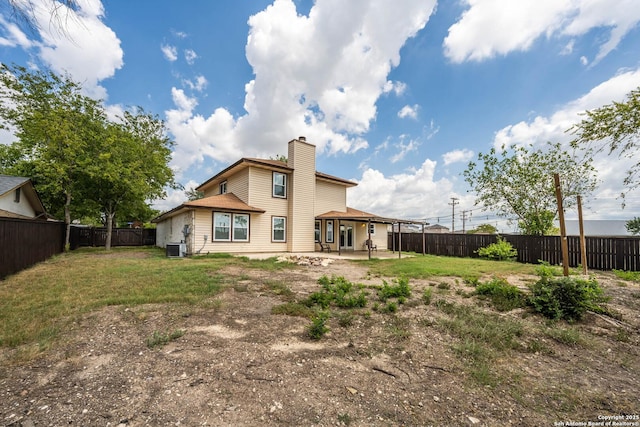 6914 Ludgate, San Antonio, TX 78239 - rear view of property featuring a fenced backyard, a chimney, and a patio