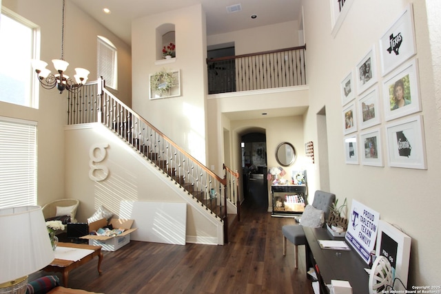 2514 Ladera Bnd, San Antonio, TX 78261 - stairway featuring a towering ceiling, a chandelier, and wood finished floors