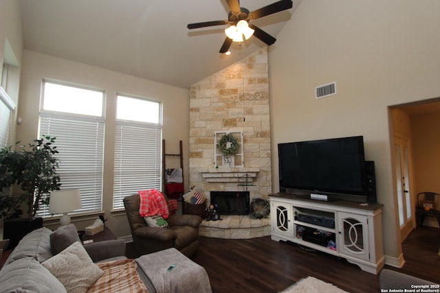 2514 Ladera Bnd, San Antonio, TX 78261 - living room featuring ceiling fan, dark wood-type flooring, a stone fireplace, and high vaulted ceiling
