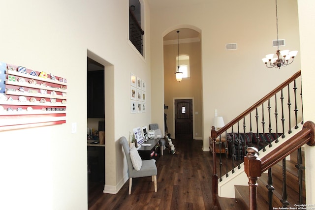 2514 Ladera Bnd, San Antonio, TX 78261 - foyer with a high ceiling, wood finished floors, arched walkways, a chandelier, and stairway