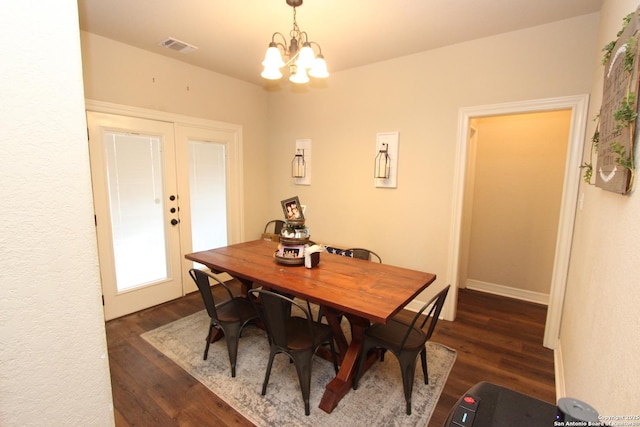 2514 Ladera Bnd, San Antonio, TX 78261 - dining room featuring dark wood-style floors, a chandelier, and french doors