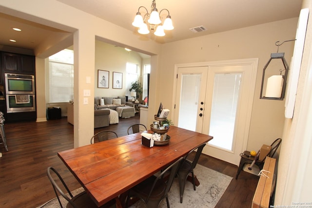2514 Ladera Bnd, San Antonio, TX 78261 - dining space featuring dark wood-style flooring, healthy amount of natural light, and a chandelier