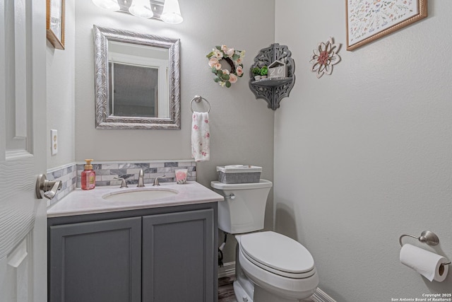 7907 Donshire, Converse, TX 78109 - half bath featuring vanity and tasteful backsplash