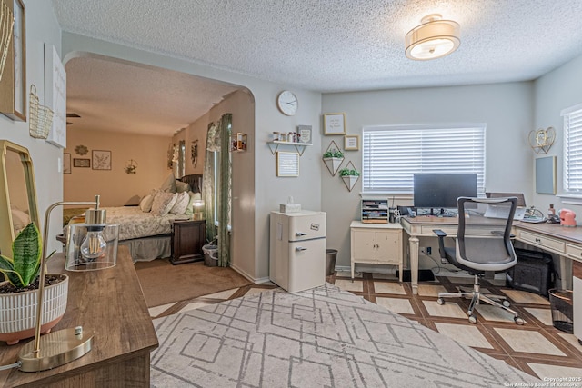 7907 Donshire, Converse, TX 78109 - office space featuring plenty of natural light, arched walkways, and a textured ceiling