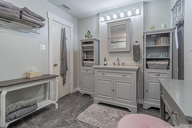 7907 Donshire, Converse, TX 78109 - bathroom with vanity and baseboards