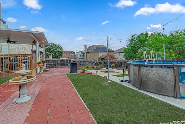 7907 Donshire, Converse, TX 78109 - fenced backyard with a patio area, a ceiling fan, and a residential view