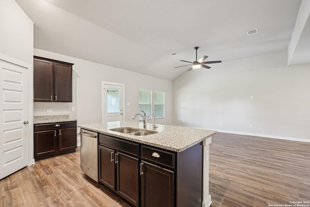 11518 Biddle, San Antonio, TX 78253 - kitchen featuring stainless steel dishwasher, a ceiling fan, light wood-style floors, lofted ceiling, and a center island with sink