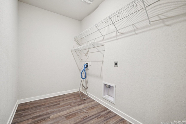 11518 Biddle, San Antonio, TX 78253 - laundry room featuring hookup for an electric dryer, washer hookup, and dark wood-style flooring