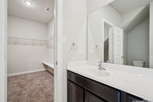 11518 Biddle, San Antonio, TX 78253 - bathroom featuring vanity and a spacious closet