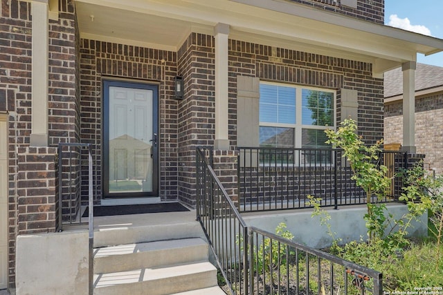 11518 Biddle, San Antonio, TX 78253 - view of exterior entry featuring brick siding and covered porch