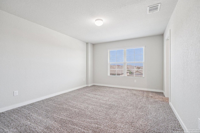 11518 Biddle, San Antonio, TX 78253 - carpeted empty room featuring a textured ceiling and baseboards