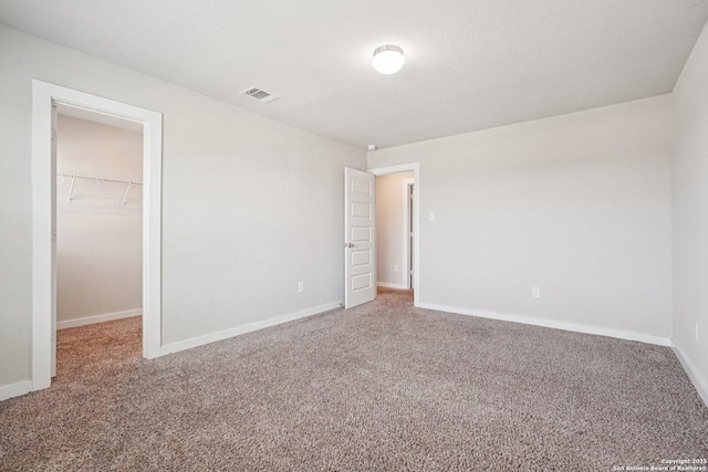 11518 Biddle, San Antonio, TX 78253 - unfurnished bedroom with a spacious closet, carpet, and a closet