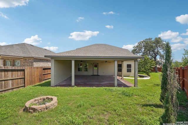 11518 Biddle, San Antonio, TX 78253 - rear view of property featuring a ceiling fan, a fenced backyard, a patio, an outdoor fire pit, and roof with shingles