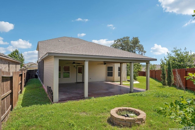 11518 Biddle, San Antonio, TX 78253 - rear view of house with ceiling fan, a fire pit, a fenced backyard, and a shingled roof