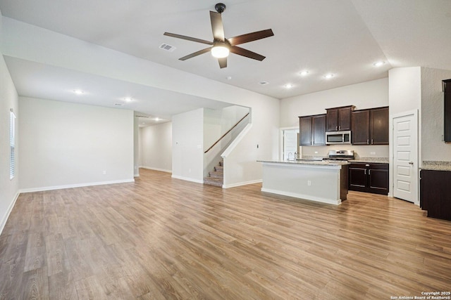 11518 Biddle, San Antonio, TX 78253 - kitchen featuring stainless steel appliances, open floor plan, light countertops, a ceiling fan, and a center island with sink
