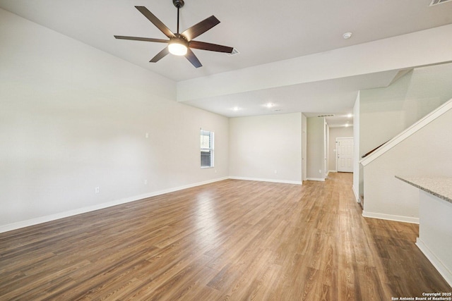 11518 Biddle, San Antonio, TX 78253 - unfurnished living room featuring ceiling fan, light wood-type flooring, stairway, and vaulted ceiling
