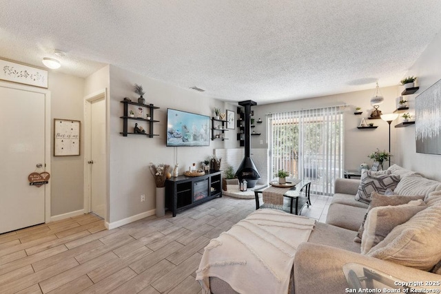923 Vance Jackson, San Antonio, TX 78201 - living area featuring wood tiled floors and a textured ceiling