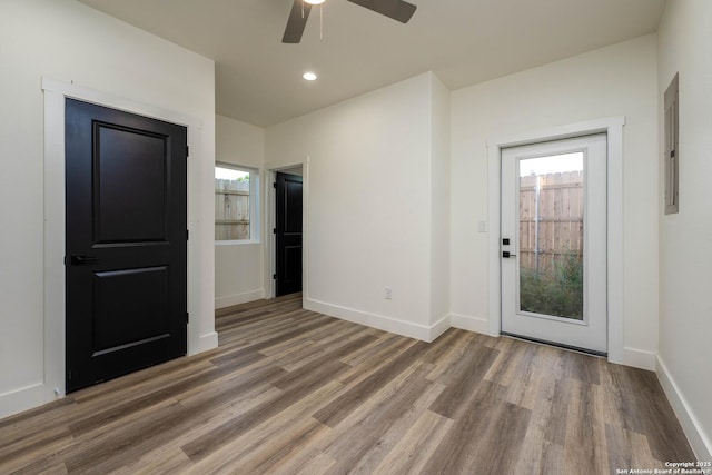 142 E Lachapelle, San Antonio, TX 78204 - empty room featuring wood finished floors, healthy amount of natural light, a ceiling fan, electric panel, and recessed lighting