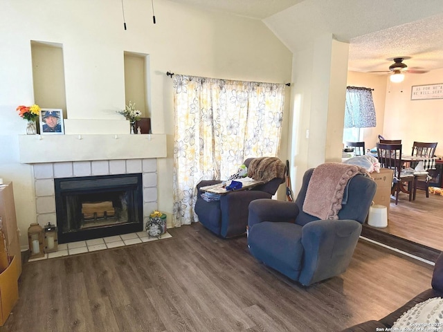 11733 Spring Rdg, San Antonio, TX 78249 - living area featuring ceiling fan, wood finished floors, and a tiled fireplace