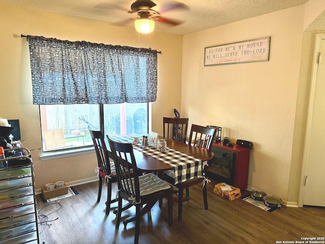 11733 Spring Rdg, San Antonio, TX 78249 - dining area featuring wood finished floors, ceiling fan, and a textured ceiling
