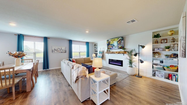 408 River Sta, Cibolo, TX 78108 - living room with a glass covered fireplace, light wood-style flooring, and recessed lighting