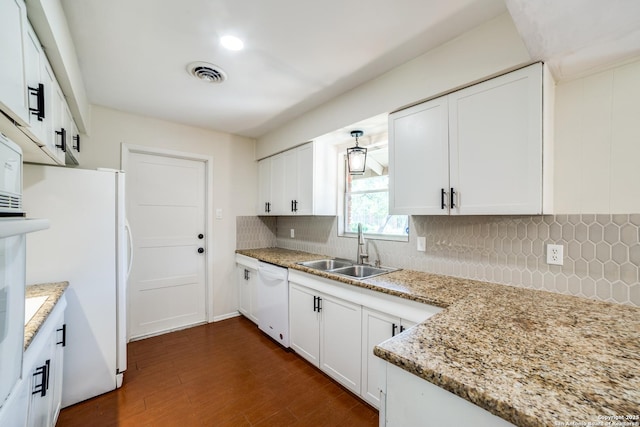 100 End Gate, Shavano Park, TX 78231 - kitchen featuring white appliances, backsplash, dark wood-type flooring, and white cabinets