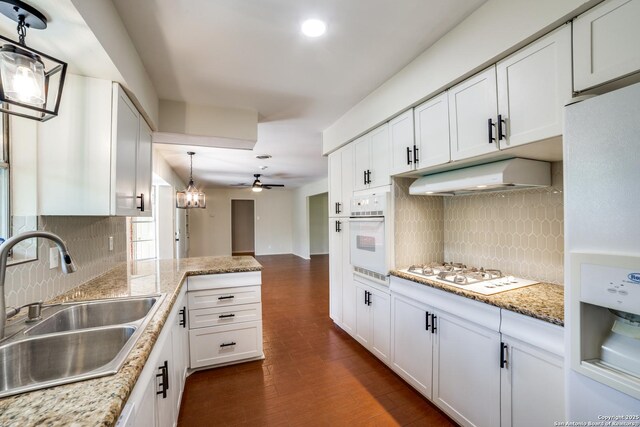 100 End Gate, Shavano Park, TX 78231 - kitchen with white appliances, extractor fan, tasteful backsplash, white cabinets, and recessed lighting