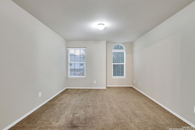 11708 Northern Star, Schertz, TX 78154 - carpeted empty room featuring a textured ceiling and baseboards