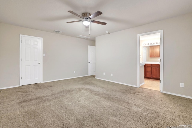 11708 Northern Star, Schertz, TX 78154 - unfurnished bedroom featuring light colored carpet, ensuite bath, and a ceiling fan