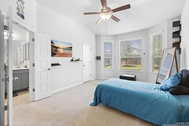 11631 Troubadour, San Antonio, TX 78245 - bedroom with light carpet, vaulted ceiling, ensuite bath, and a ceiling fan