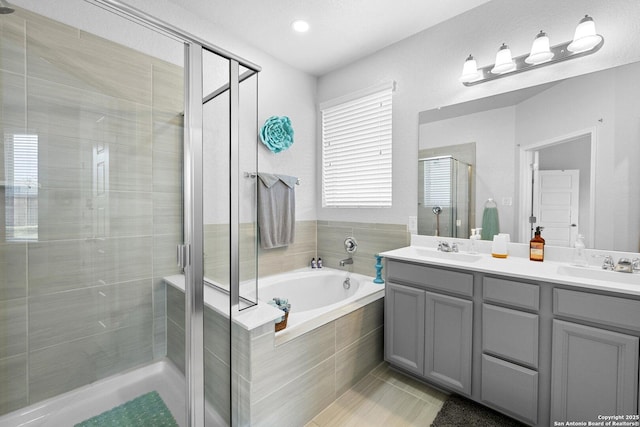 11631 Troubadour, San Antonio, TX 78245 - full bath with a shower stall, double vanity, a garden tub, and tile patterned floors